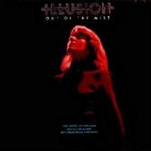 Album cover featuring a woman's face illuminated in red against a black background.
