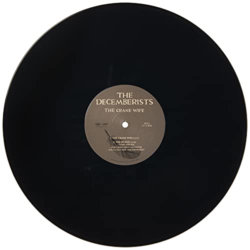 Black vinyl record with a beige label featuring "The Decemberists - The Crane Wife".