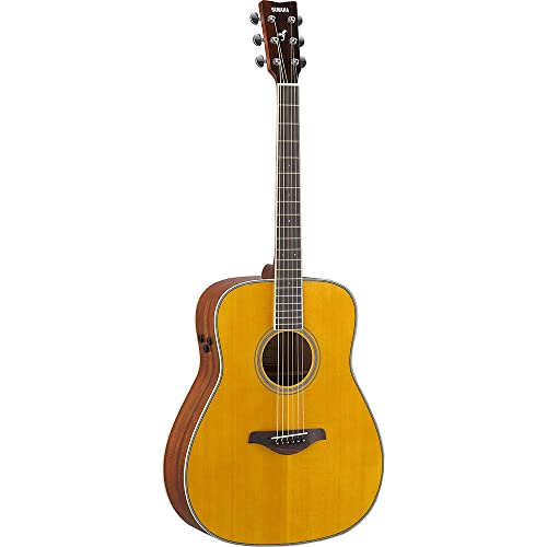 Acoustic guitar with a light wood finish, viewed from the front.