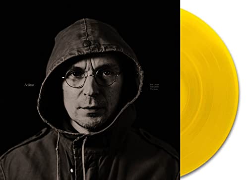 Vinyl record cover featuring a hooded man and a yellow disc.