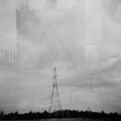 Black and white photo of power lines against a cloudy sky.