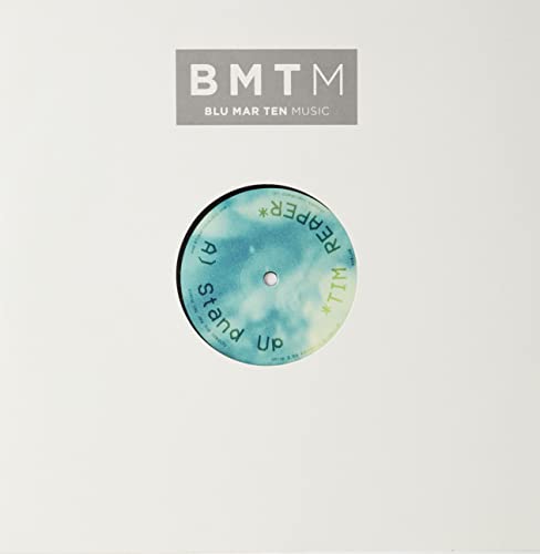 Vinyl record with teal label, text “Tim Reaper - Stand Up” and logo.