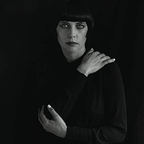 Black and white portrait of a woman with short dark hair.