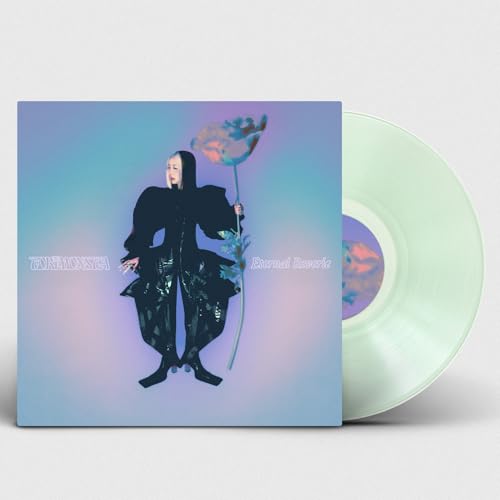 Vinyl record and album cover featuring a person holding a flower.