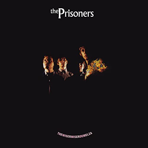 The Prisoners album cover: four figures in suits against a black background.