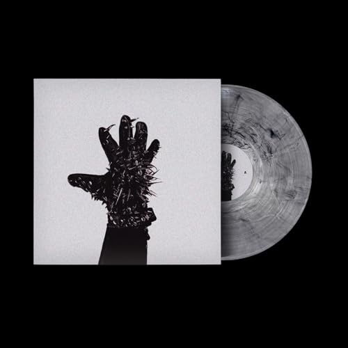 Vinyl record with cover art featuring a dark, distorted hand image.