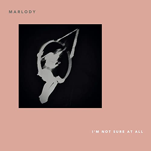 Vinyl record cover: blurred figure in a light-filled dark circle.