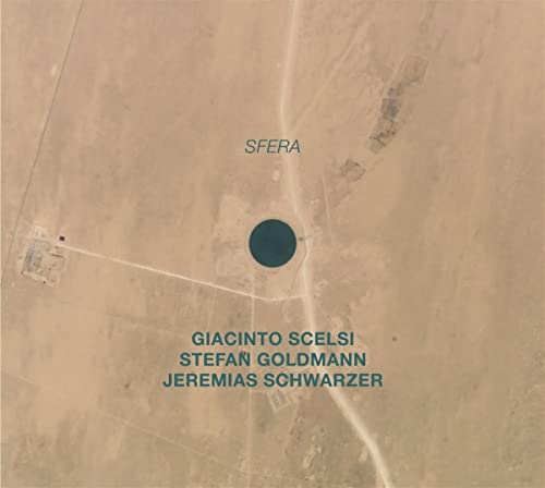 Aerial view of a dark circle in a desert landscape, CD cover.