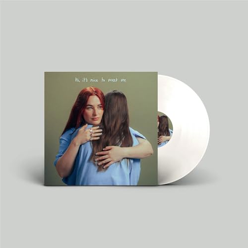 Album cover with two women embracing, beside a white vinyl record.