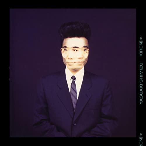 Portrait of Yasuaki Shimizu in a suit, album cover for “Kiren”.