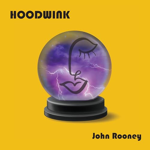 Yellow album cover featuring a crystal ball with a face inside.