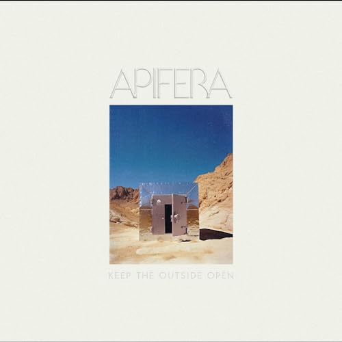 Apifera album cover: a small mirrored structure in a desert landscape.