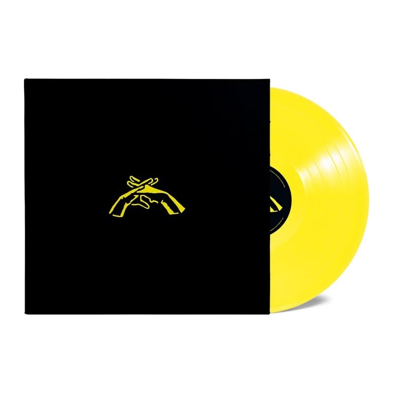 Yellow vinyl record with black sleeve featuring golden hand illustration.