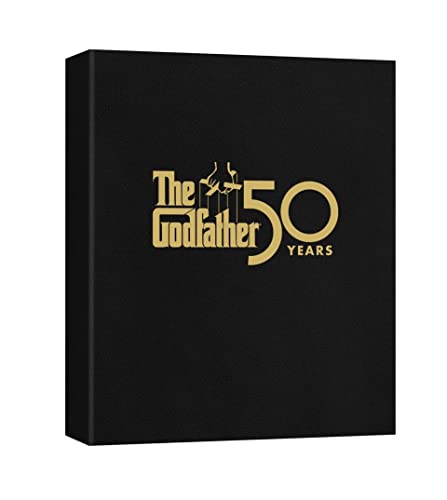 Black box set for "The Godfather" with gold lettering and a hand silhouette.