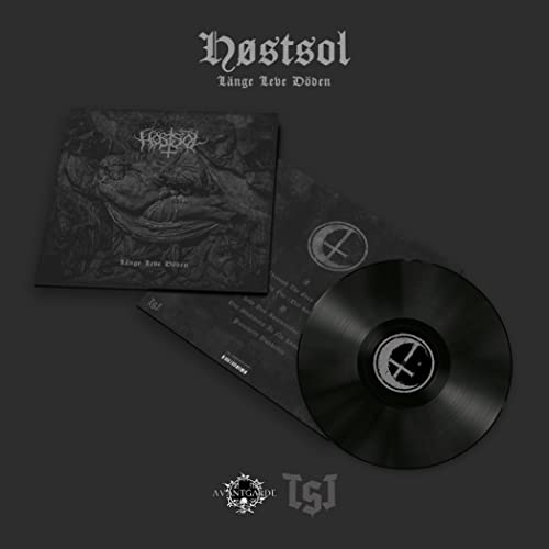 Black vinyl record and album cover with dark, intricate artwork.