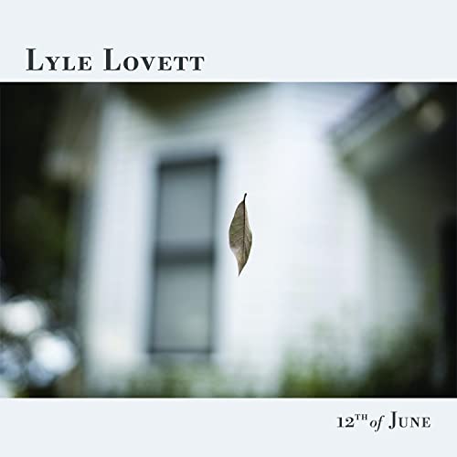 CD cover for Lyle Lovett’s “12th Of June” with a blurred house and leaf.