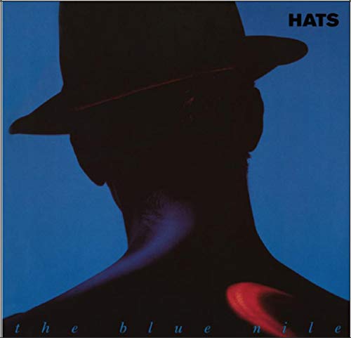 LP cover: Silhouette of a man in a hat against blue background.