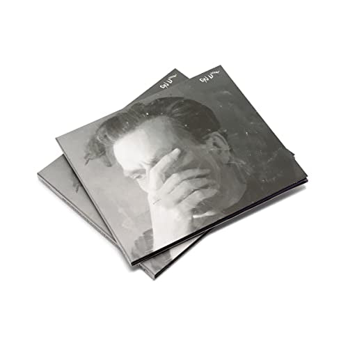 CD case with a black and white portrait of a man covering his face.