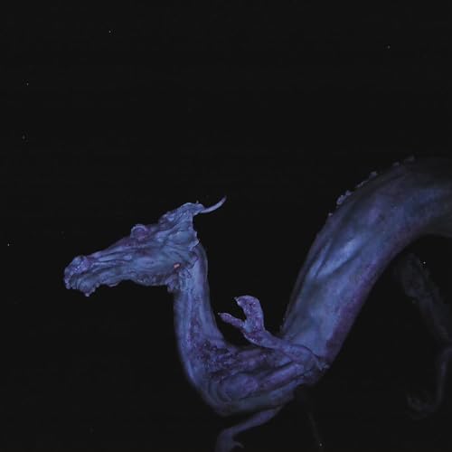 AH blue creatureC-shaped sea dragon againstC against a solid black background.