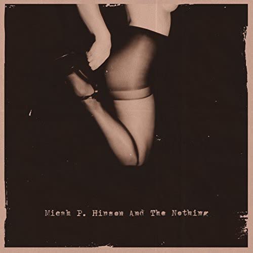 CD cover: legs in stockings, dark background, band name below.