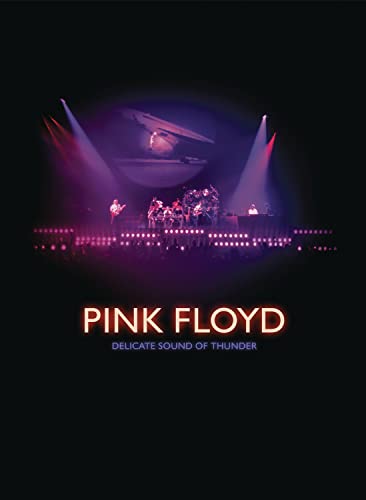 Pink Floyd concert stage with lights and band members performing.