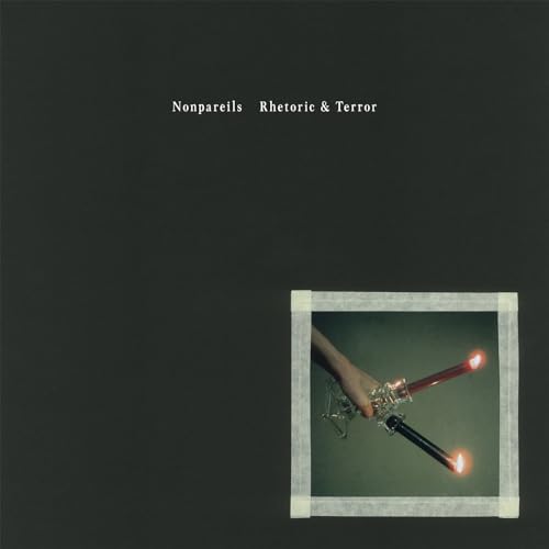 CD cover: dark background with a hand holding two lit candles in a frame.