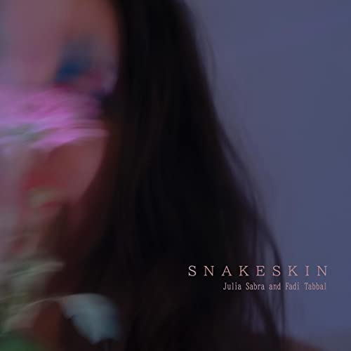 Album cover for "Snakeskin" by Julia Sabra and Fadi Tabbal, featuring a blurred face.