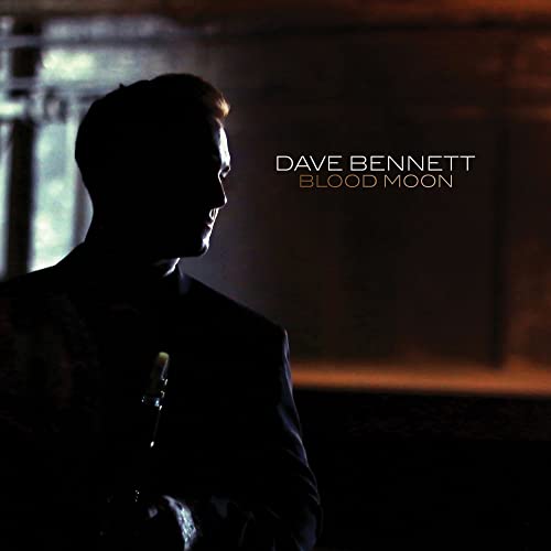 CD cover: Silhouette of a man with a saxophone, “Blood Moon” title.