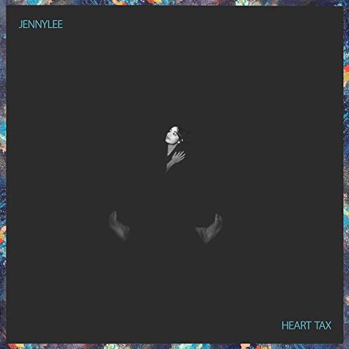 Jennylee’s “Heart Tax” vinyl cover: a grayscale figure in darkness.