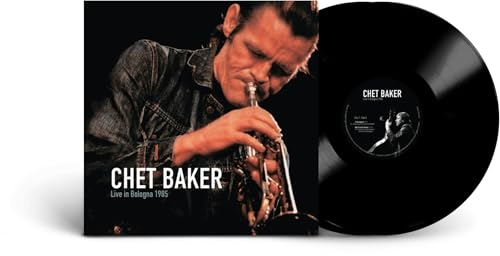 Chet Baker playing trumpet on album cover next to a black vinyl record.
