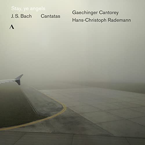 Vinyl album cover: foggy airport runway with text listing artists and title.