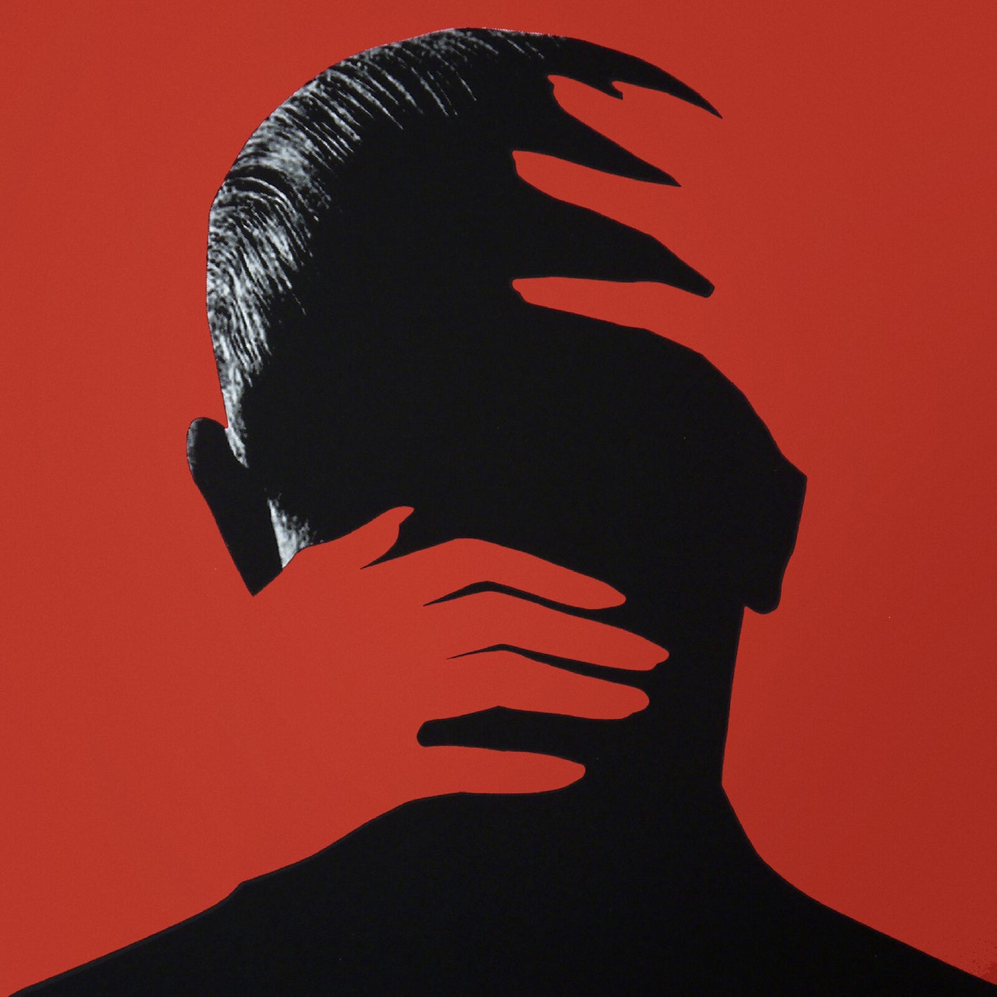 Silhouetted head and hand against a solid red background.
