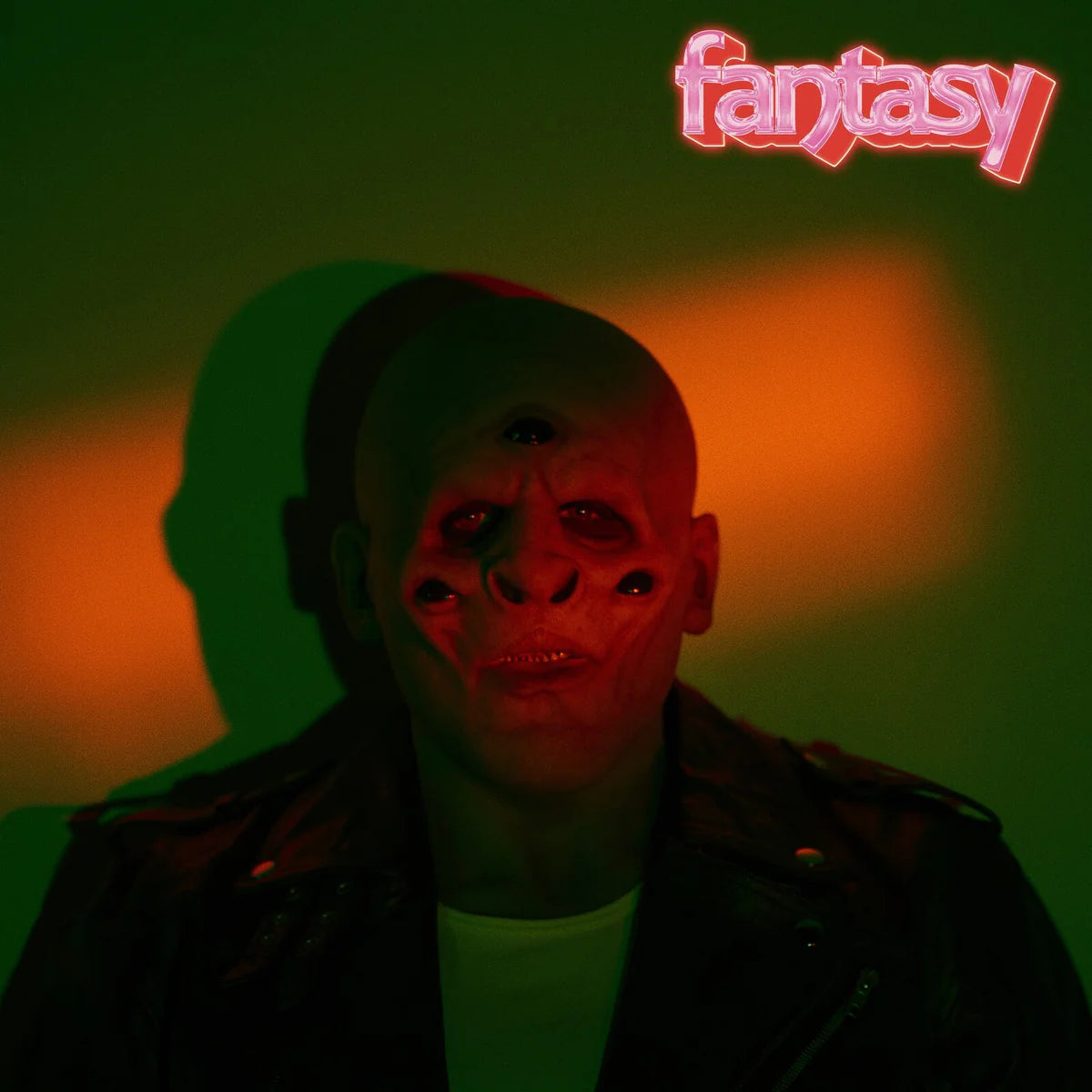 Album cover for M83's "Fantasy" featuring a distorted face in red and green light.