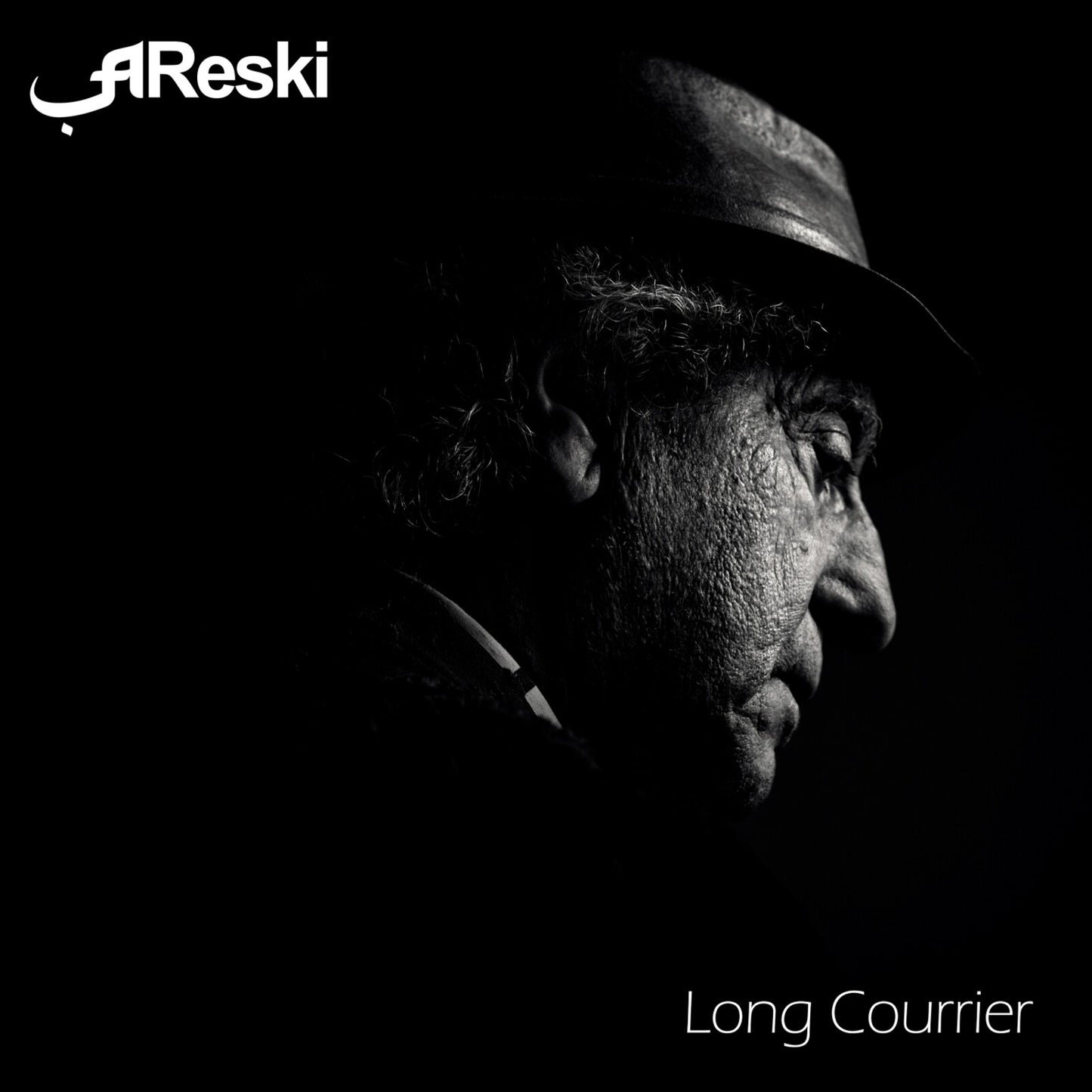 Black and white portrait of a man in a hat, album cover.