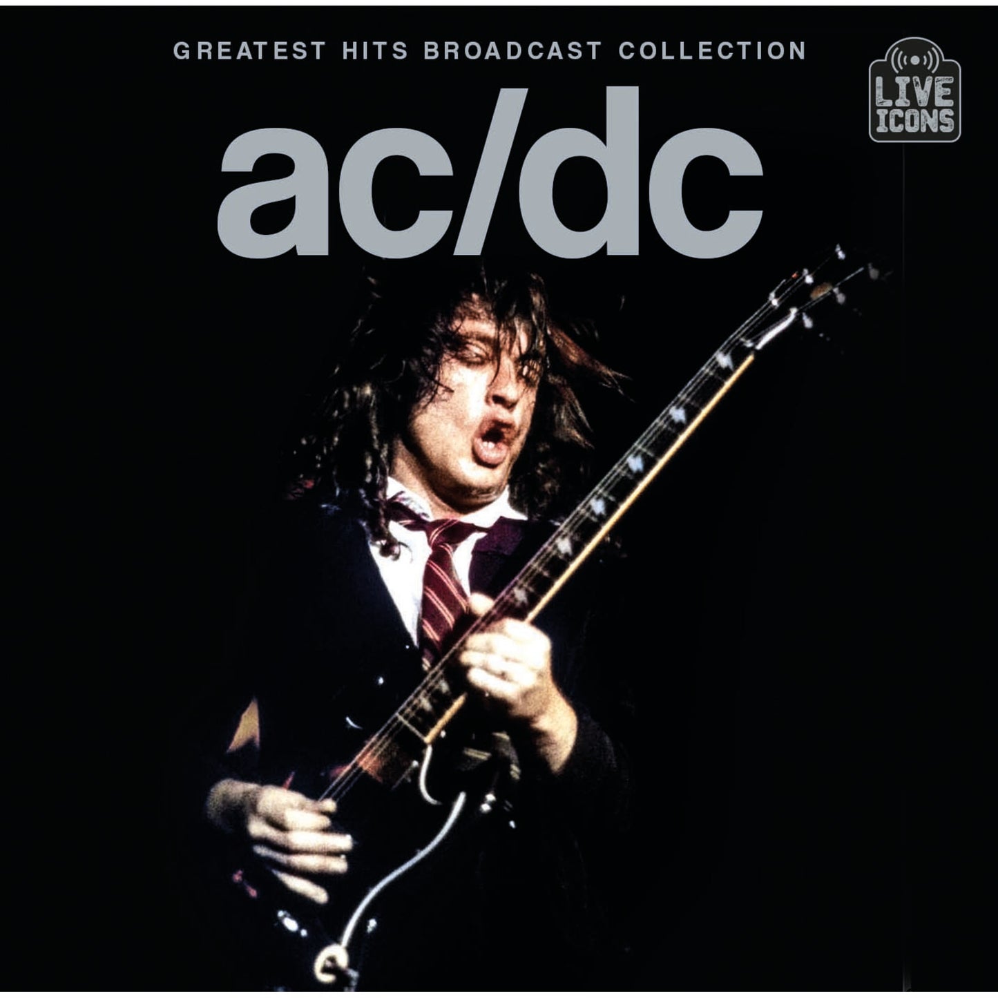 Angus Young playing guitar on stage with AC/DC Greatest Hits Broadcast Collection album cover.