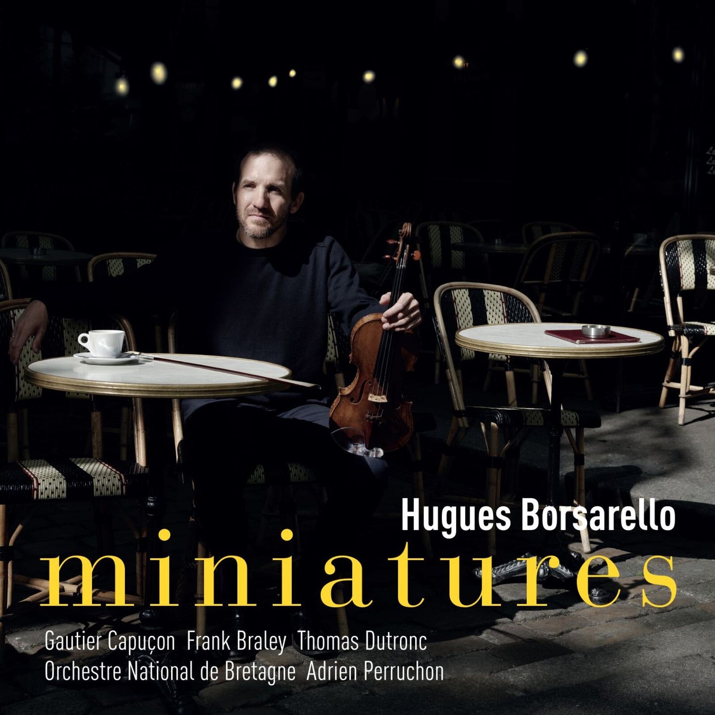 Man with cello seated at cafe table, album cover for "miniatures".