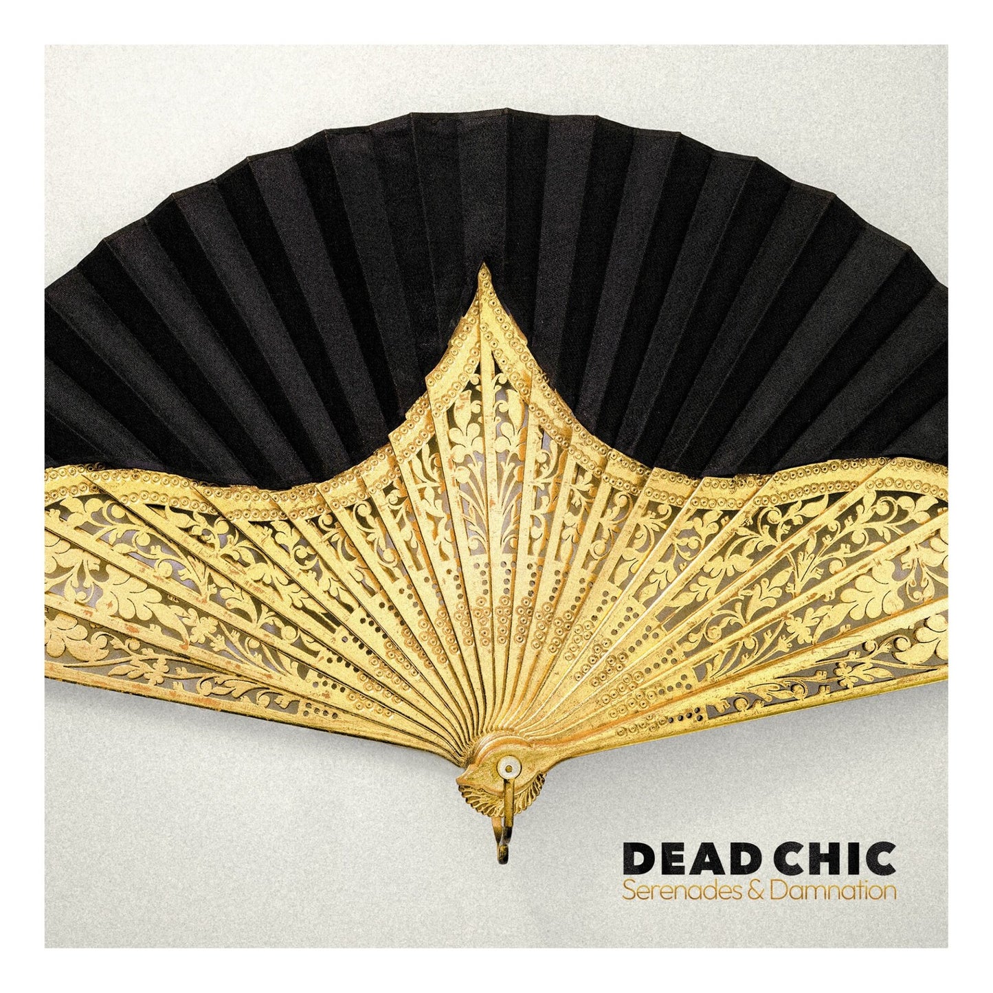 Ornate gold fan spread against a textured gray background, album art.