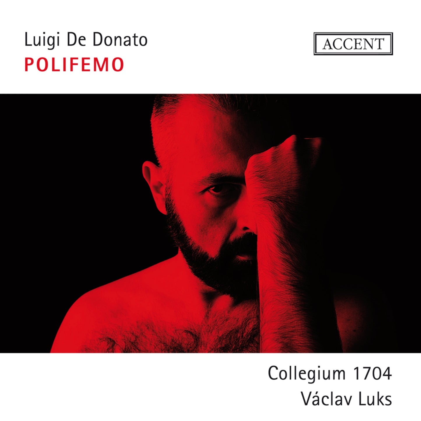 CD cover: Dramatic portrait of a bearded man in red light.
