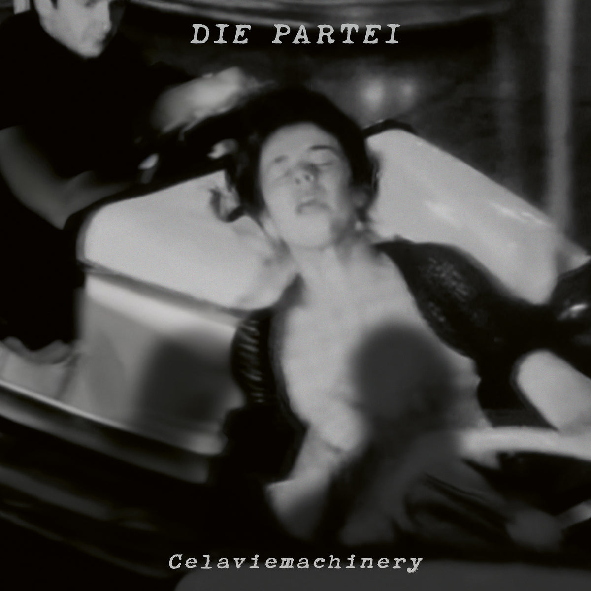 Black and white album cover featuring a distorted image of a person lying down.