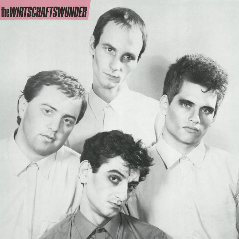 Black and white portrait of four young men, album cover art.