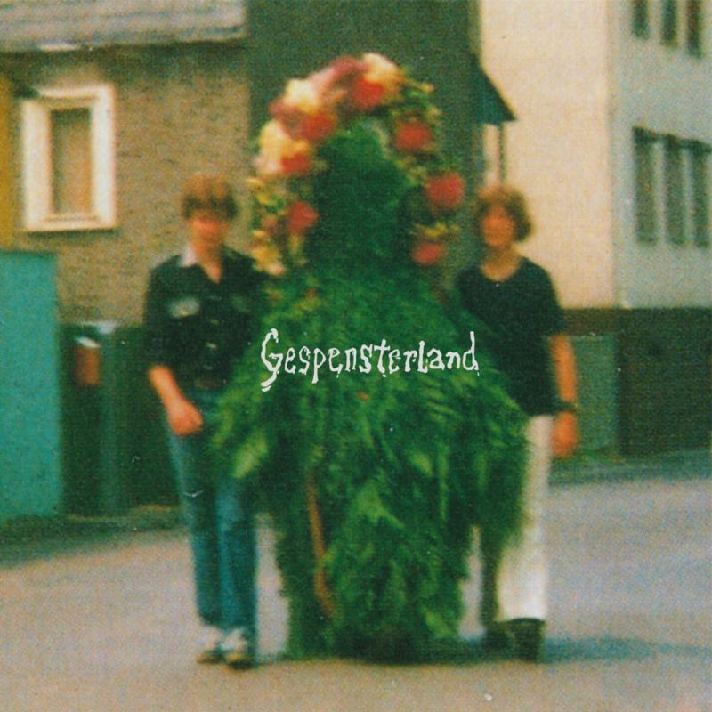 Album cover: two figures obscured by large floral headgear.