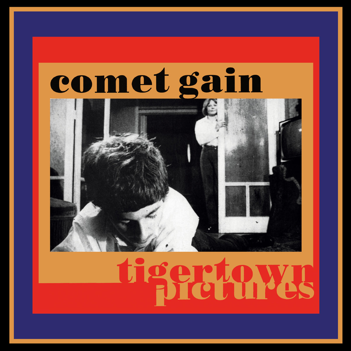 Vinyl record cover: black and white photo with red and blue borders.