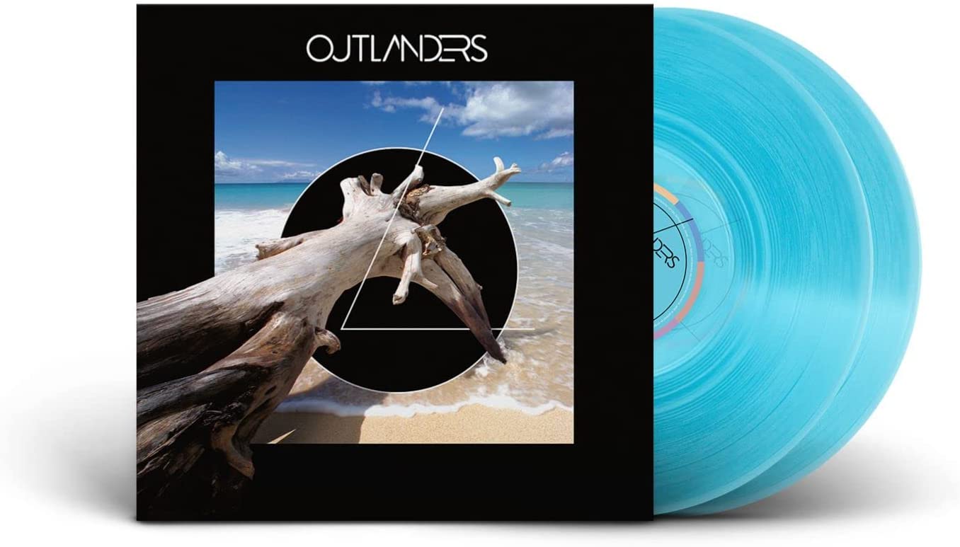 Blue vinyl record with album art featuring a beach and driftwood.