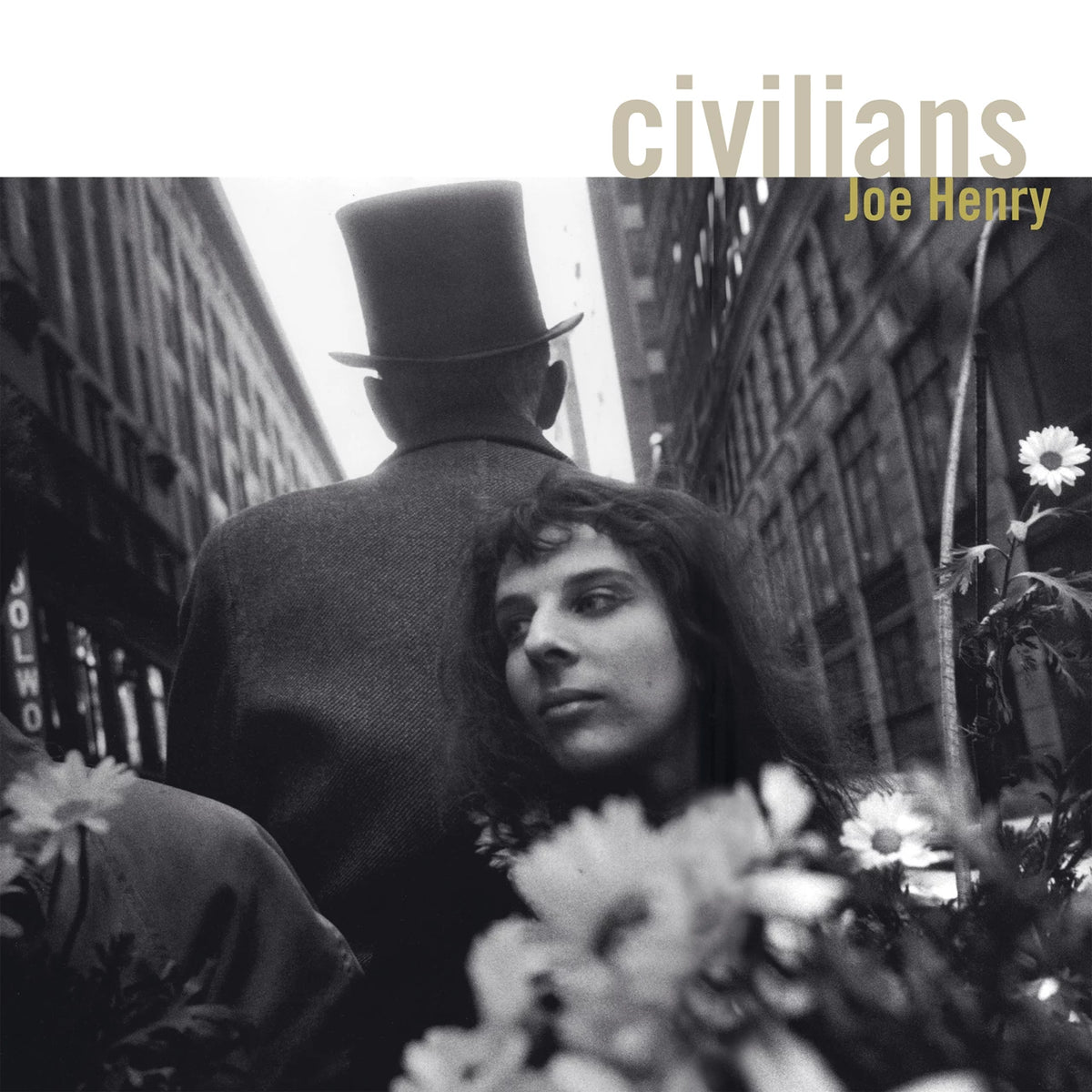 Black and white album cover featuring a man, woman, and flowers.