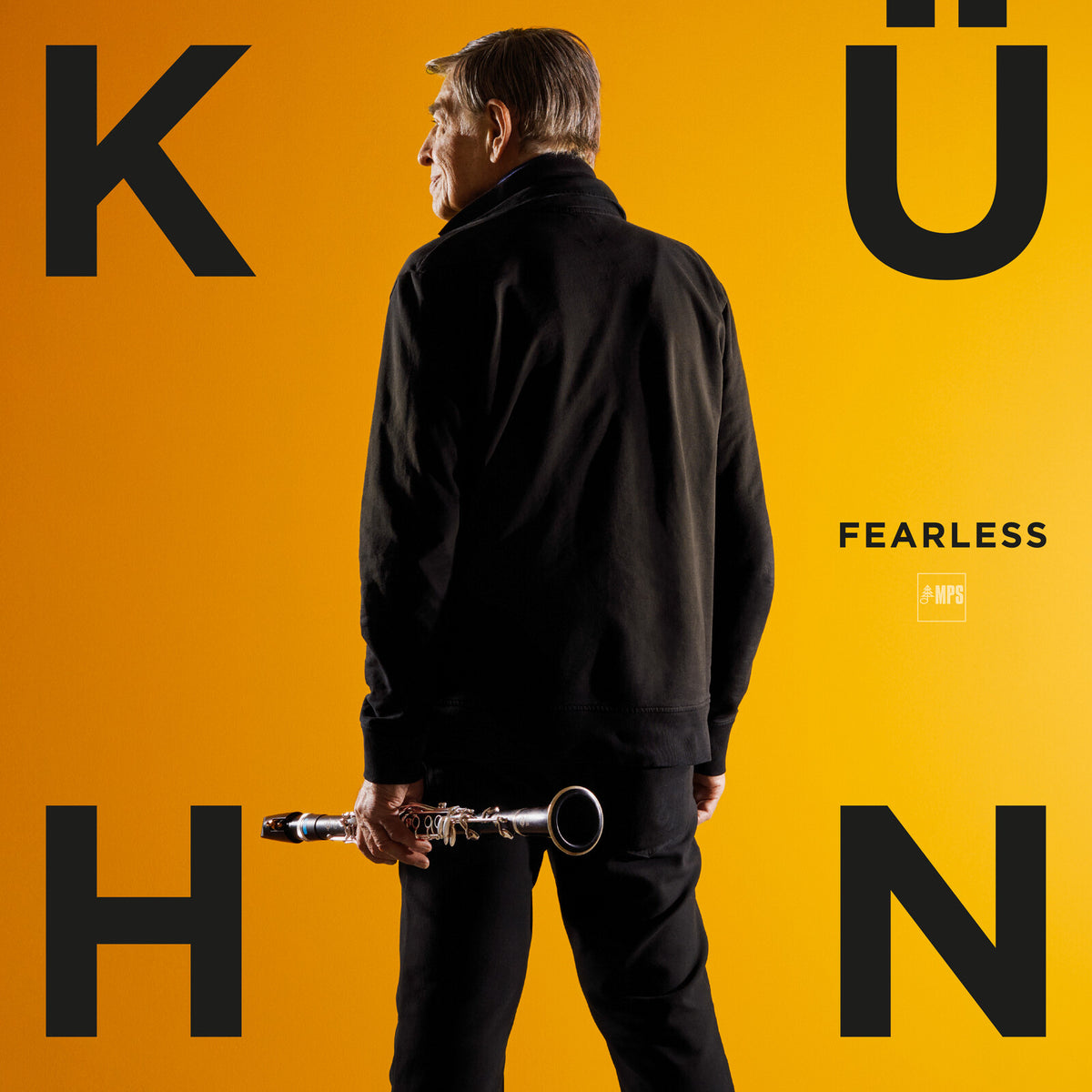 Rolf Kuhn portrait with clarinet, bold yellow and black typography.