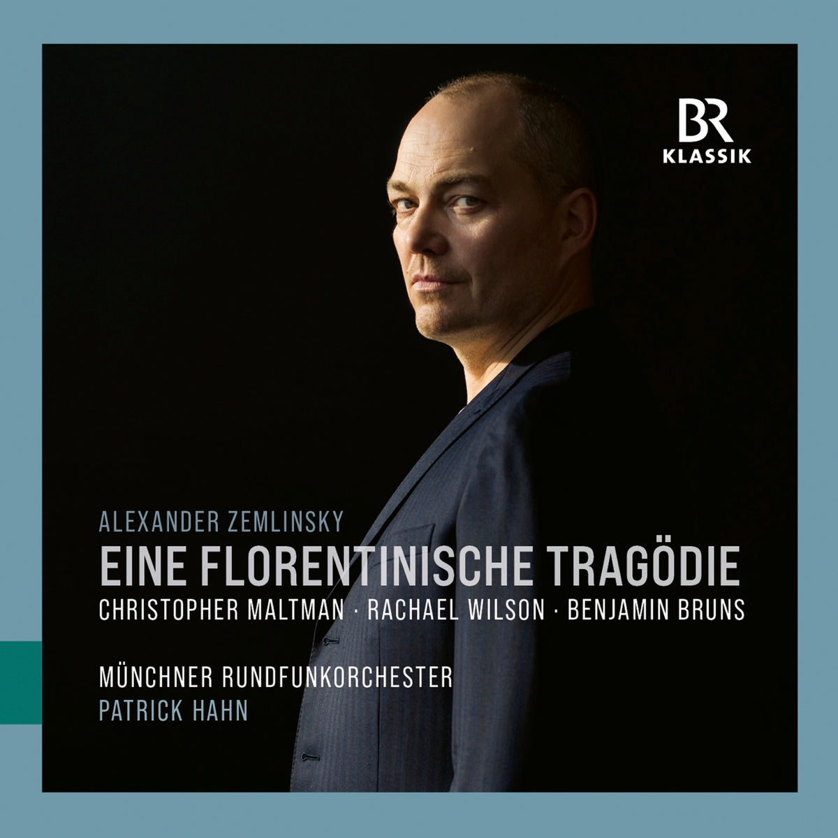 CD cover featuring a portrait of a man in a suit, text details.