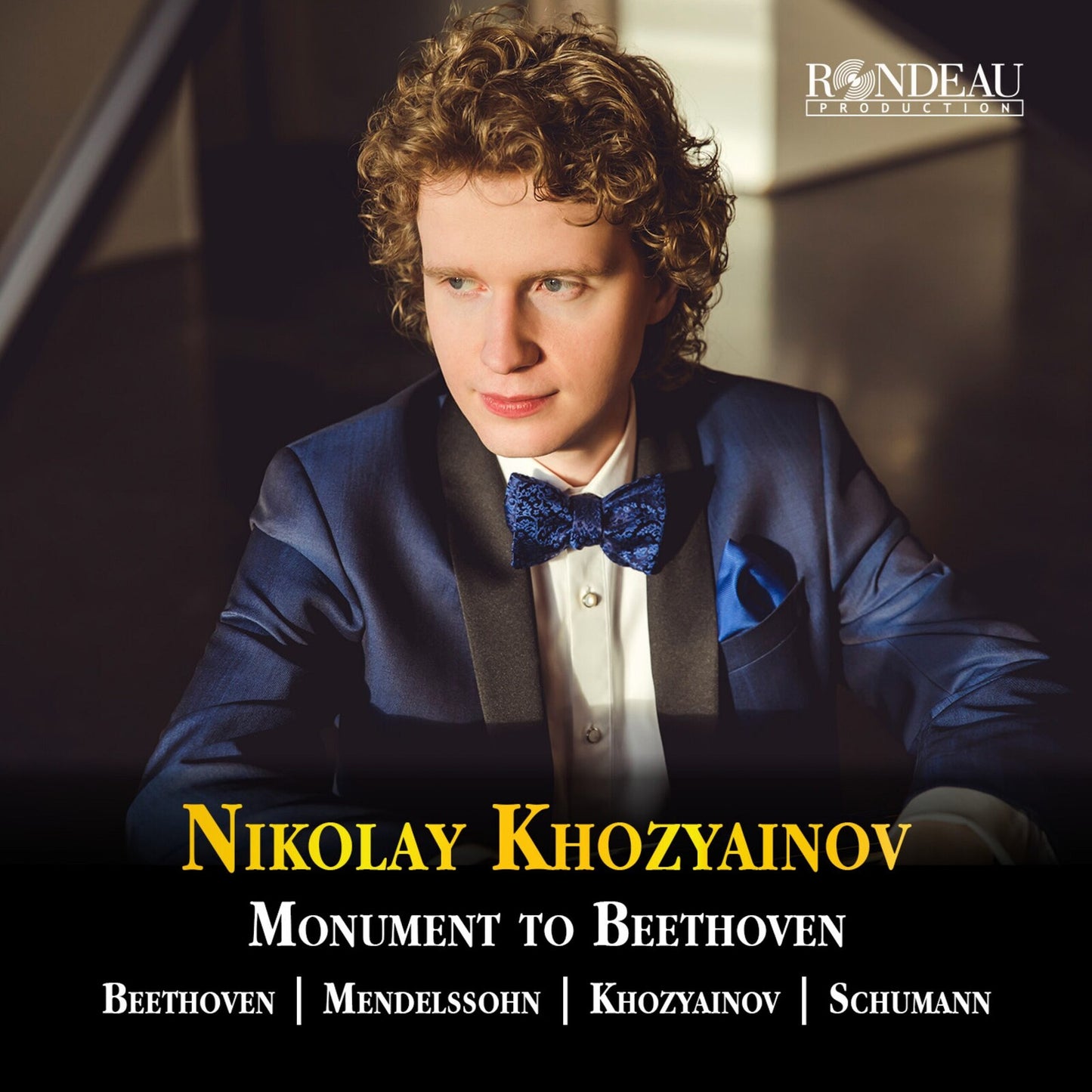 CD cover featuring pianist Nikolay Khozyainov in formal wear.