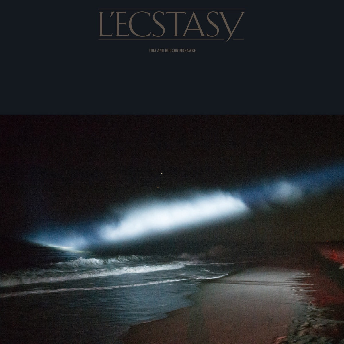 Vinyl record cover: dark seascape with bright light beams.