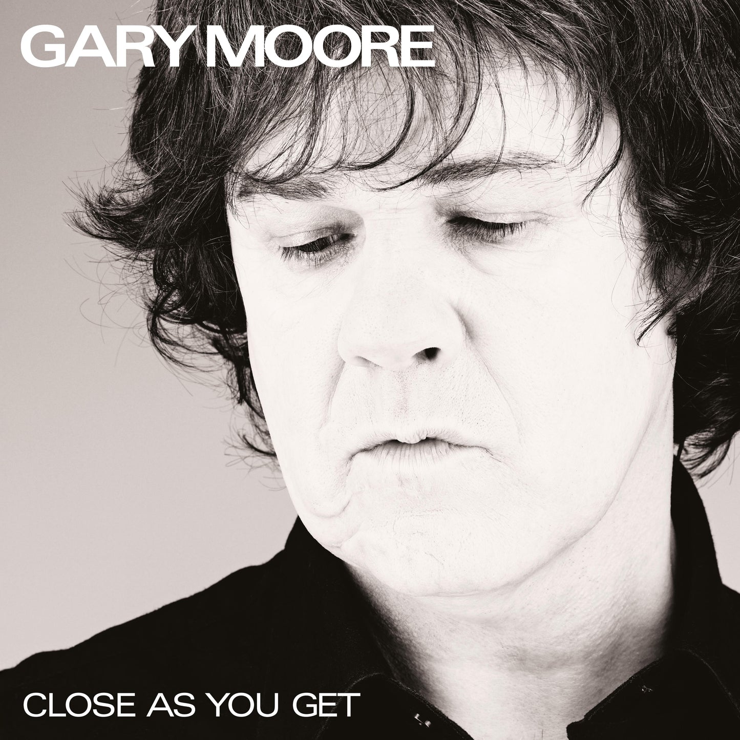 Black and white portrait of Gary Moore, album cover "Close as You Get".