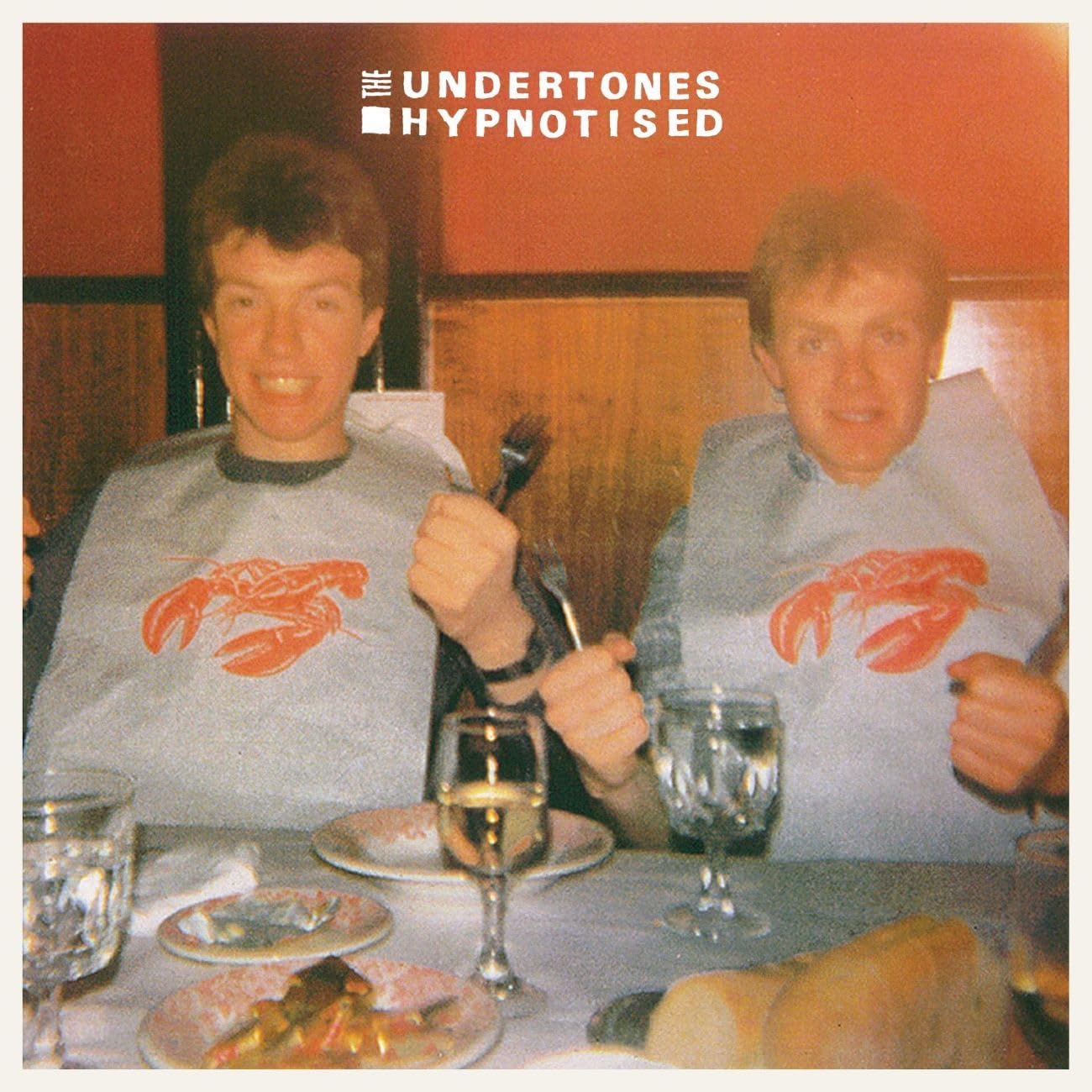 CD cover for The Undertones’ “Hypnotised” featuring two men with lobsters.